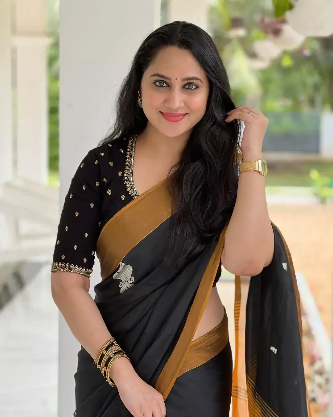 Beautiful Indian Queen Miya George in Traditional black Saree